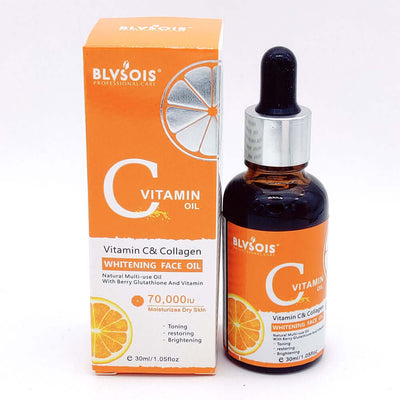 Vitamin C and Collagen whitening face oil in a sleek bottle with orange packaging for moisturizing and brightening dry skin.